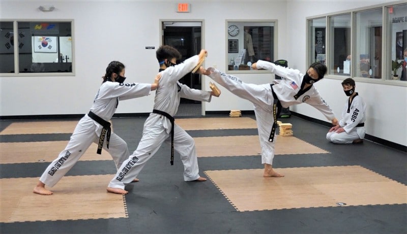 Students practicing kicks